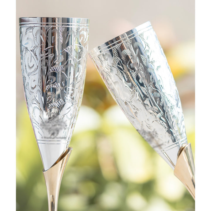 Close-up of ornate detailing on Natures Cart champagne glasses – silver and brass finish